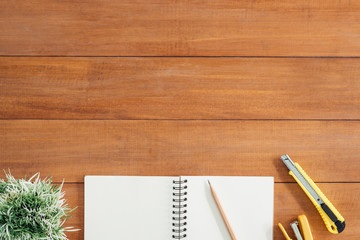 Minimal work space - Creative flat lay photo of workspace desk. Office desk wooden table background with open mock up notebooks and pens and plant. Top view with copy space, flat lay photography.