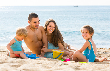 Family of four at the beach