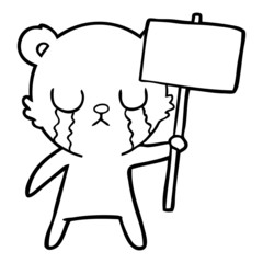 crying cartoon bear with sign
