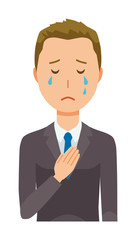 A young businessman is crying