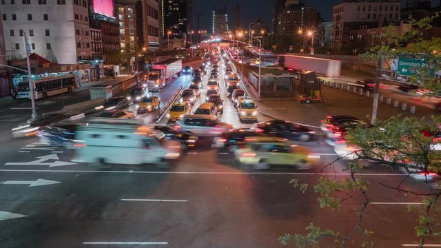 Tilting motion timelapse of Roosevelt Island tram night view Ed Koch Queensboro 59th Street Bridge.