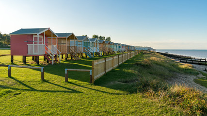 Beach huts with sea view in Leysdown-on-Sea, Isle of Sheppey, Kent, England, UK