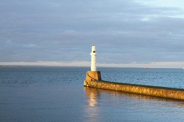 Fototapeta premium Lighthouse surrounded by the sea