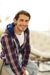 stylish young man in plaid shirt.