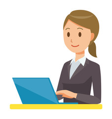 A business woman in a suit is operating a laptop computer