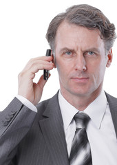 closeup.serious businessman talking on mobile phone.