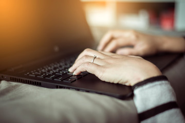 Close up hands woman working using laptop and connecting wifi,Toned image