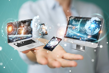 Tech devices connected to each other by businesswoman 3D rendering