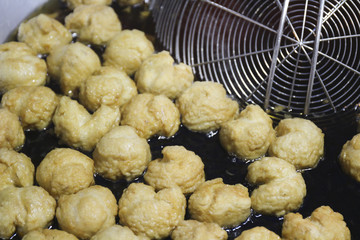 deep fried fish balls in wok