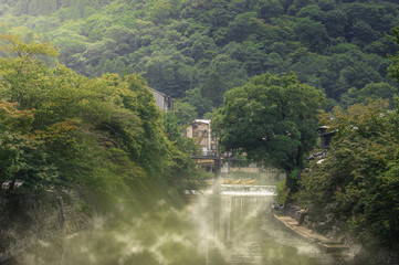Fototapeta na wymiar Foggy on river on morning at countryside