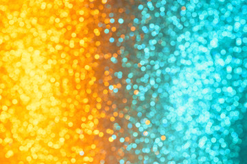 Colorful festive orange and cyan festive lights defocused bokeh abstract background