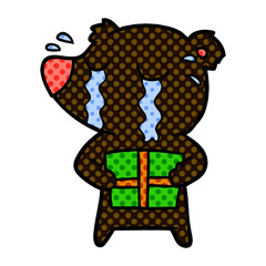 cartoon crying bear with present