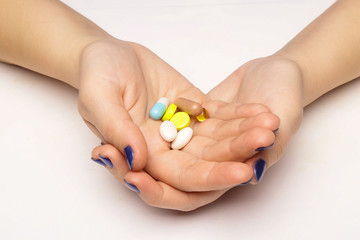 Medical tablets in hands isolated white background.