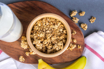 Healthy Breakfast with Muesli Cereal in Bowl and Milk in Bottle
