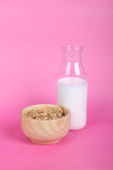 Healthy Breakfast with Muesli Cereal in Bowl and Milk in Bottle