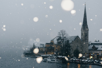 Old town of Hallstatt, Austria. Idyllic winter image with the famous Hallstatt town, one of the World Heritage Sites in Austria, located on the Hallstatter lakeshore, under the first snow. 