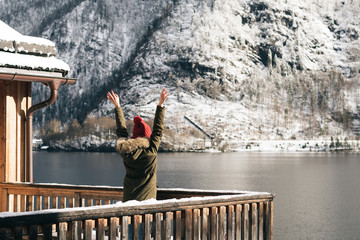 Woman enjoy view from balcony. Carefree winter vacation. 