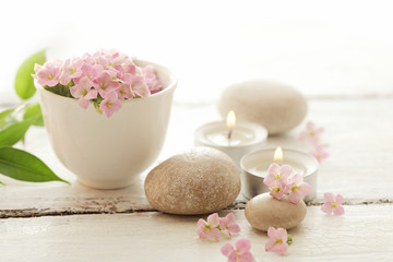 Fototapeta na wymiar SPA still life - pebbles and flowers