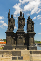 Fototapeta na wymiar PRAGUE, CZECH REPUBLIC - JUNE 25,2016: Statues of Saints Norbert, Wenceslaus and Sigismund on the Charles Bridge at Prague, Czech Republic..