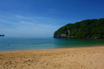 Fototapeta na wymiar View of empty Cat Ba sandy Beach. Cat Ba Island, Ha long Bay, Vietnam, Asia