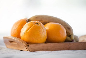 oranges and bananas on a white background
