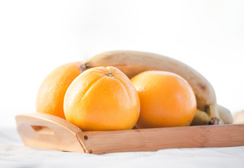 oranges and bananas on a white background