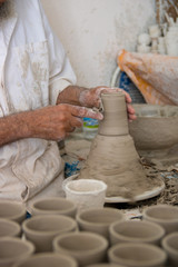 Fototapeta na wymiar street life morocco marrakech medina making mosaic and painting and making ceramic pots manual labor