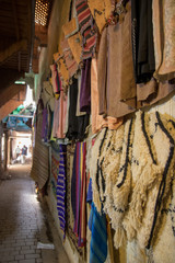 Fototapeta na wymiar street life morocco marrakech medina leather products in the streets, jackets, bags, slippers