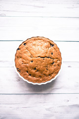 Banana bread with blueberries on a wooden table
