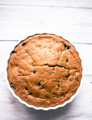 Banana bread with blueberries on a wooden table