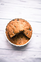 Banana bread with blueberries on a wooden table