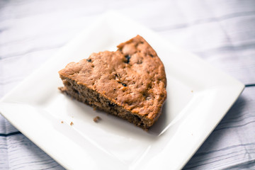 Banana bread with blueberries on a wooden table
