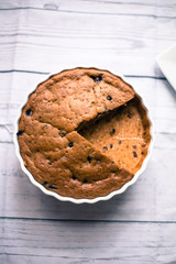 Banana bread with blueberries on a wooden table