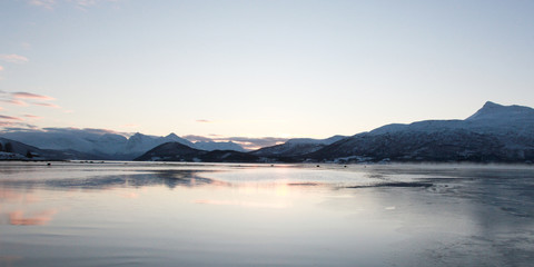 Winter time on forest lake sunset