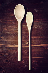 wooden spoon on dark wooden table vintage