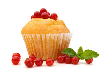 tasty muffin cake and red berries, on white