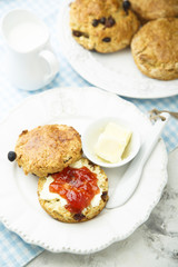 Fresh homemade scones with butter and jam