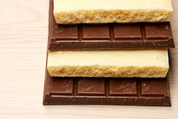 stack of dark and white chocolate on table