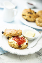 Fresh homemade scones with butter and jam