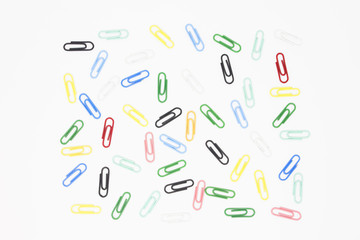 colorful paper clips and clothespins isolated