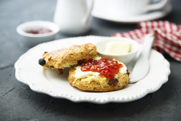 Fresh homemade scones with butter and jam