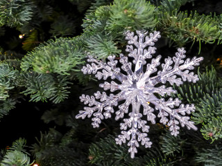 blur snowflake ornament on Christmas tree 