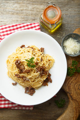 Homemade Bolognese pasta with grated cheese