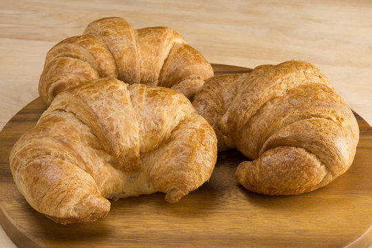 croissants on round cutting board