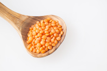 Grains of orange raw lentils. Organic dry cereal