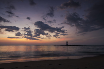 sunset on the beach and light house