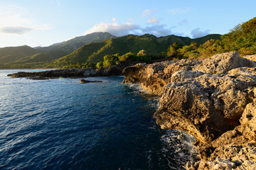 Fototapeta na wymiar Cuban coast at the foot of mountains Sierra Maestra and above the coast of the Caribbean sea