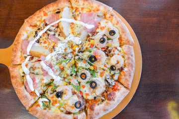 Fresh Pizza on wooden table