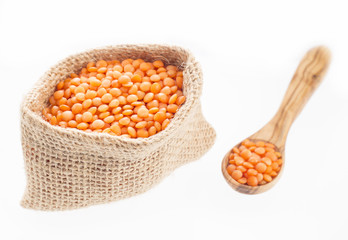 Grains of orange raw lentils. Organic dry cereal