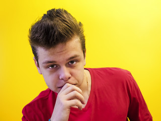 OLYMPUStudio shot of a young handsome guy on a colored backgroundS DIGITAL CAMERA